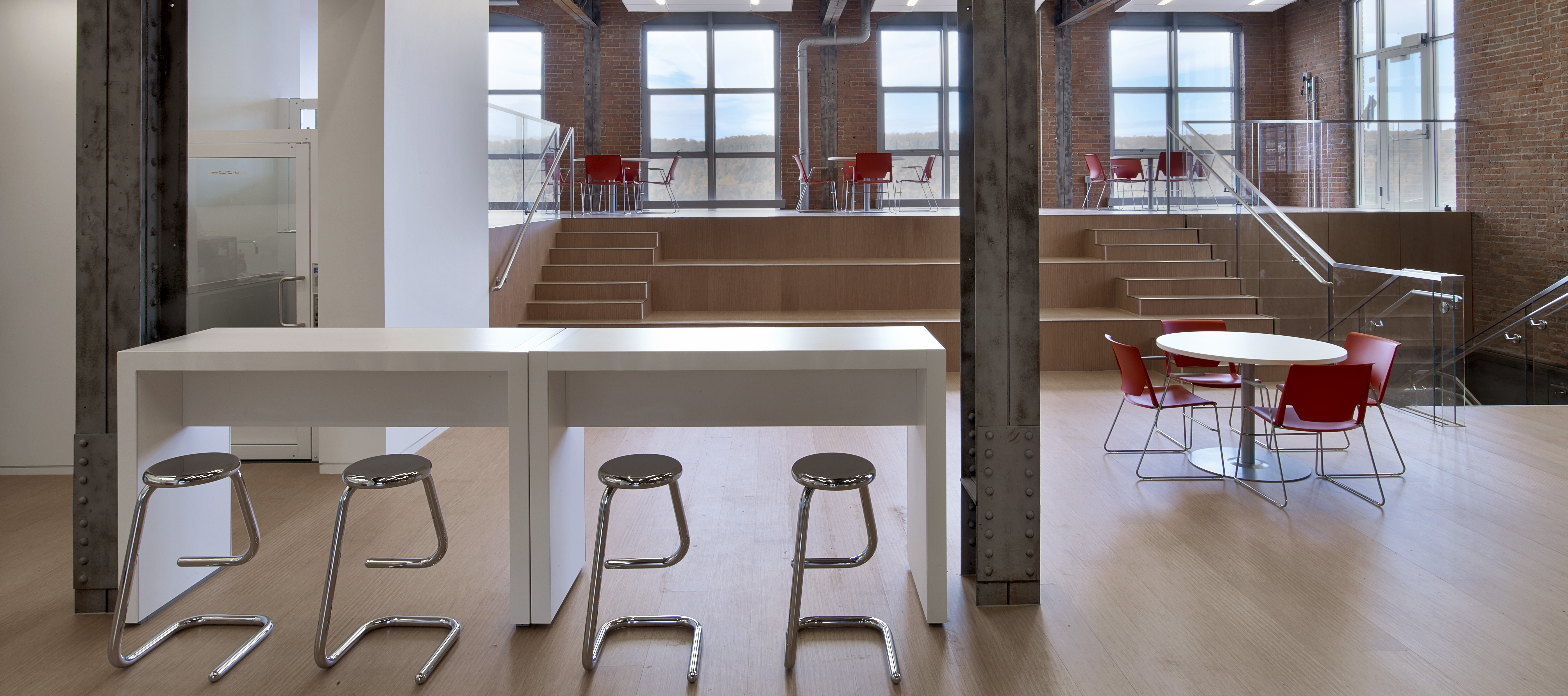 Patterns table & K700 stools in the foreground; Very Wire stacker chairs & Compose tables in the background at IAC Mindspark.