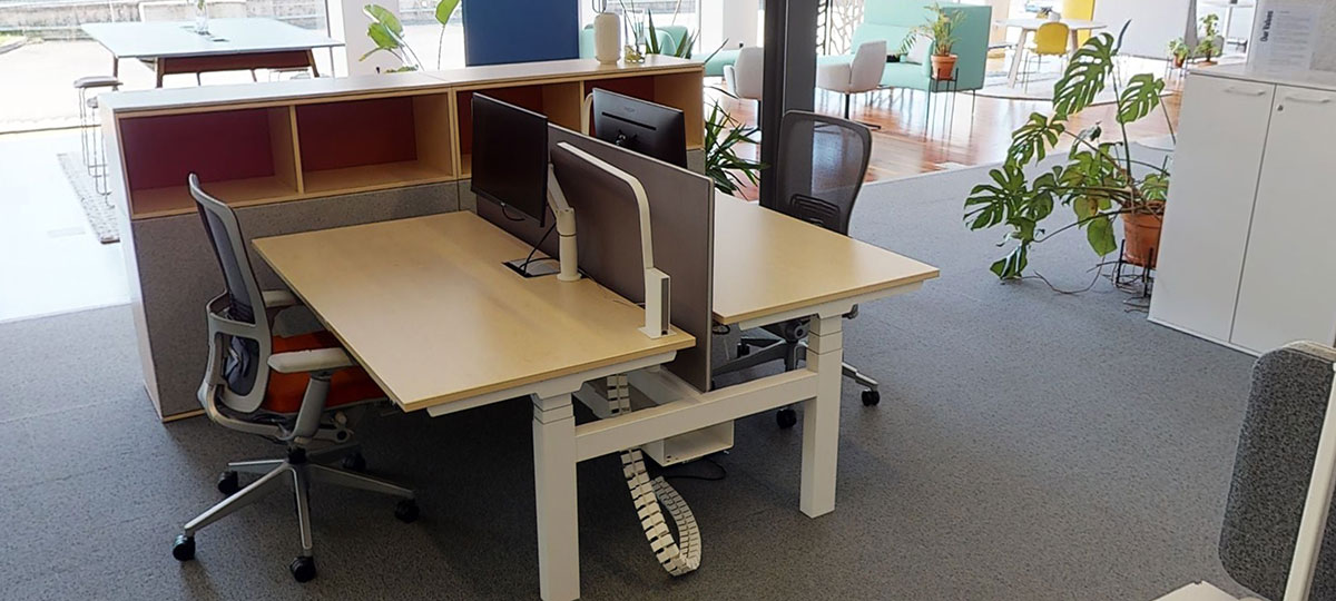 The classic individual Lyft desks, with height adjustment, privacy screens and Zody office chairs. Personal storage acts as a visual and auditory barrier from the main thoroughfare. 