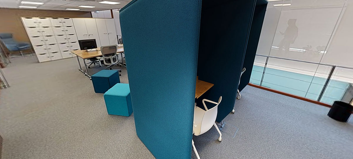 Standalone booths offer a quiet spot for solo concentration without completely isolating the user.