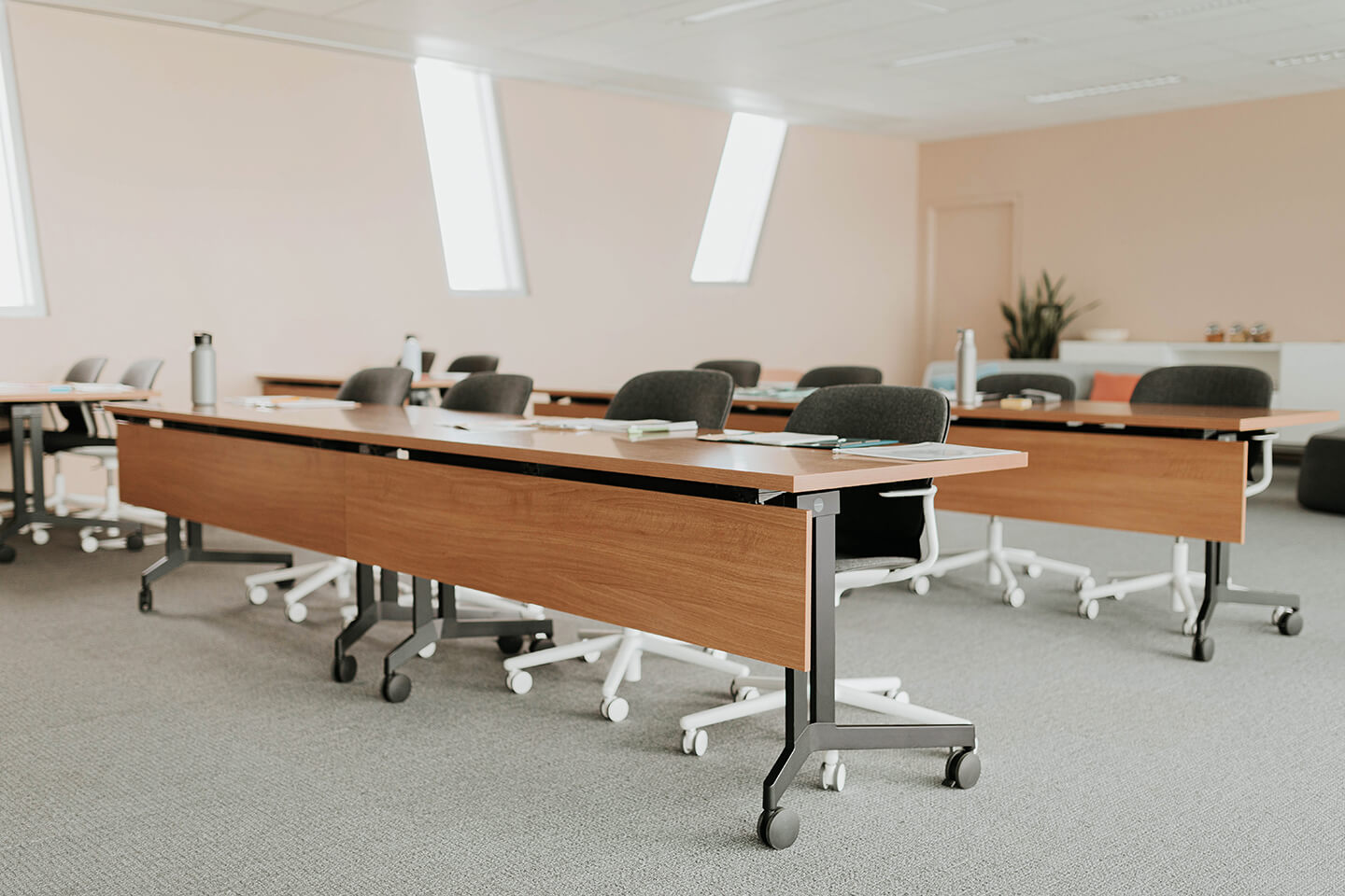 Haworth Planes Training table in a conference room with multiple chairs and set up for training