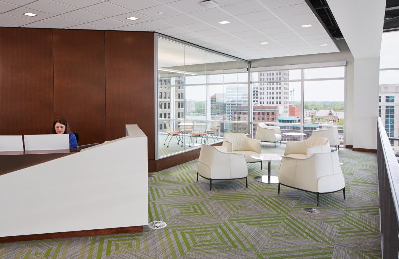 Haworth Archibald white leather lounge chairs in open office space