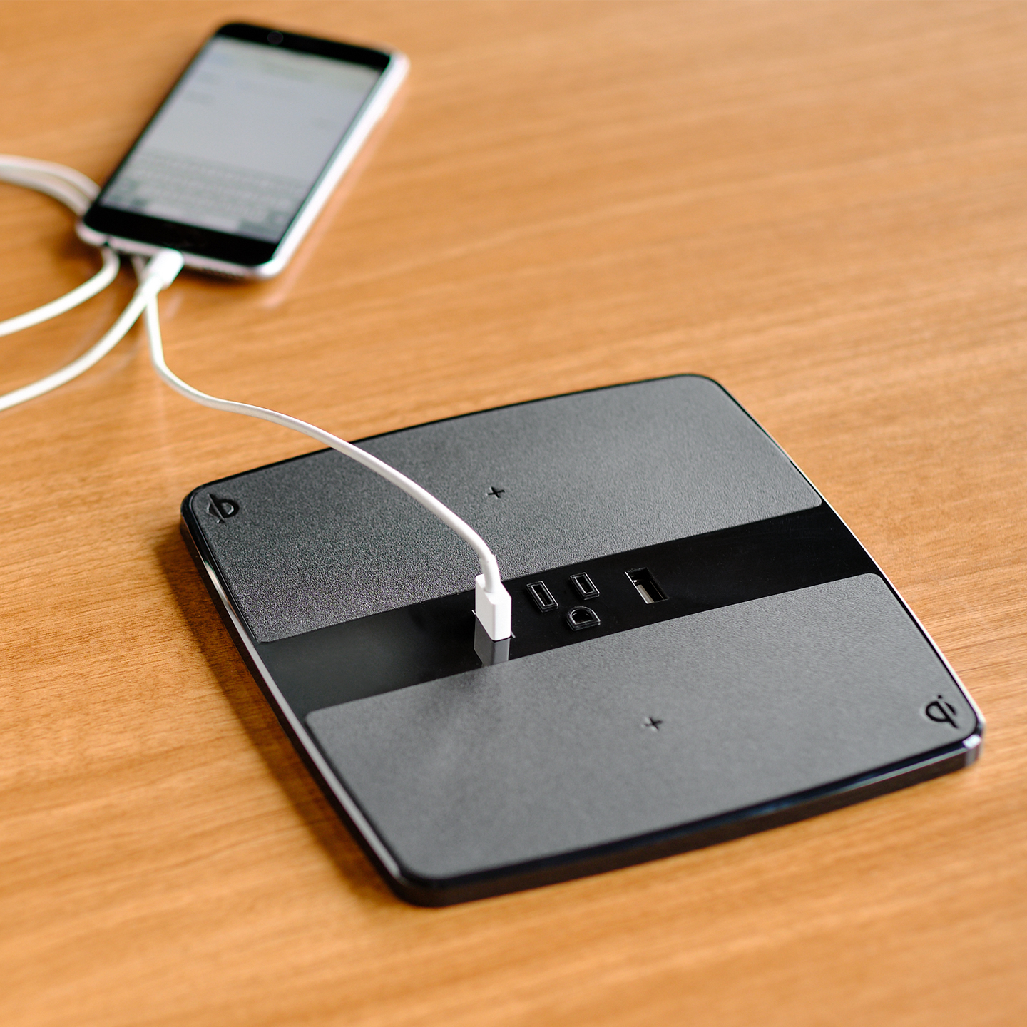 Haworth Collaborative Power Accessories on a desk with a phone plugged into the USB port