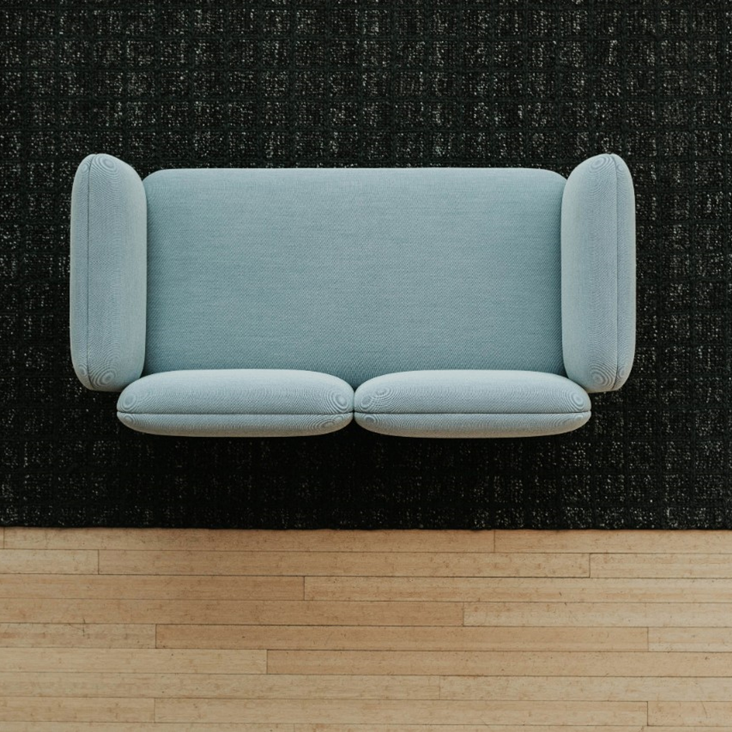 Haworth Mangas Natural Rug in black color squares pattern on floor with blue couch above it