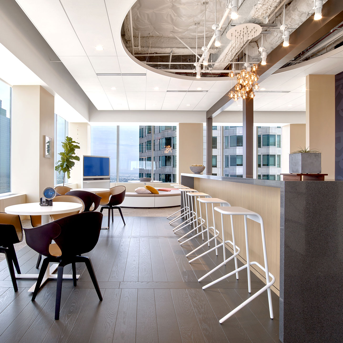 A row of Haworth Alodia white stools in an open lounge area