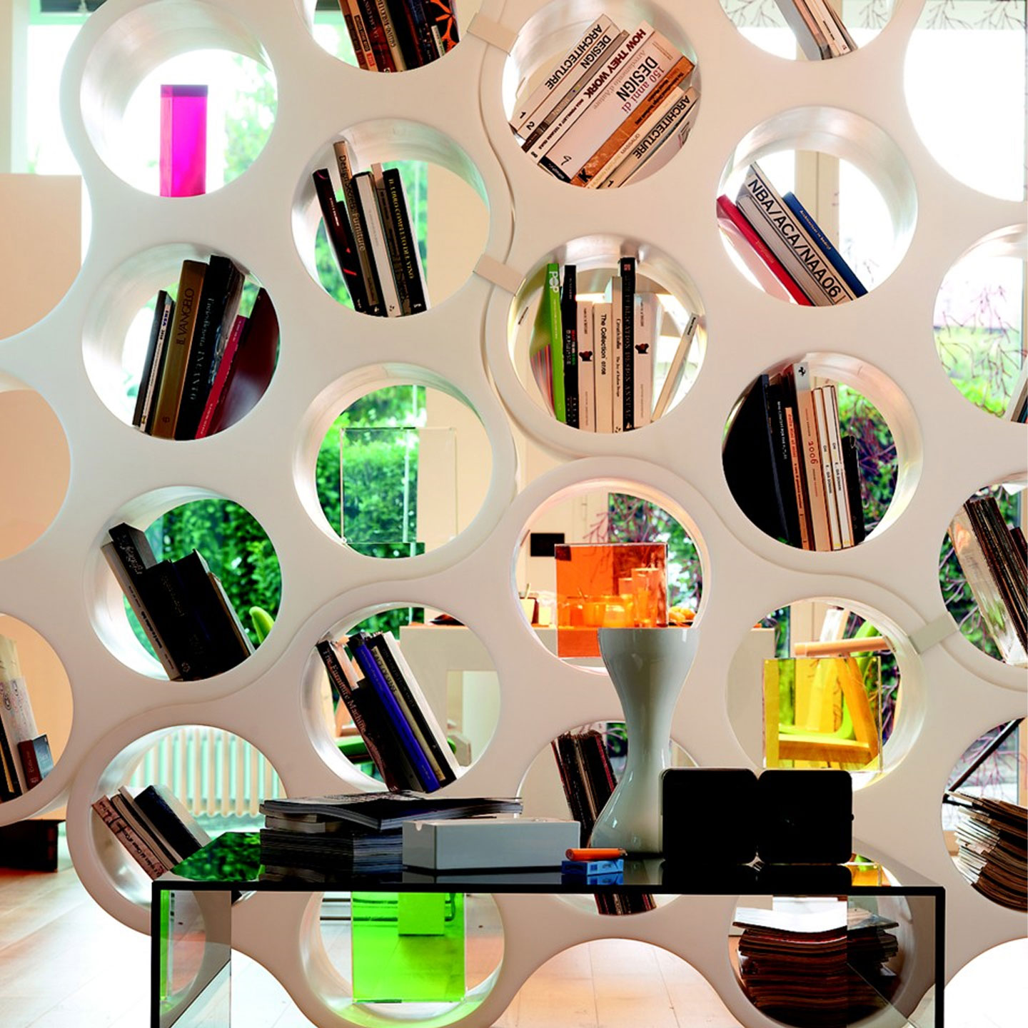 White cloud bookshelf with books and décor on shelves..