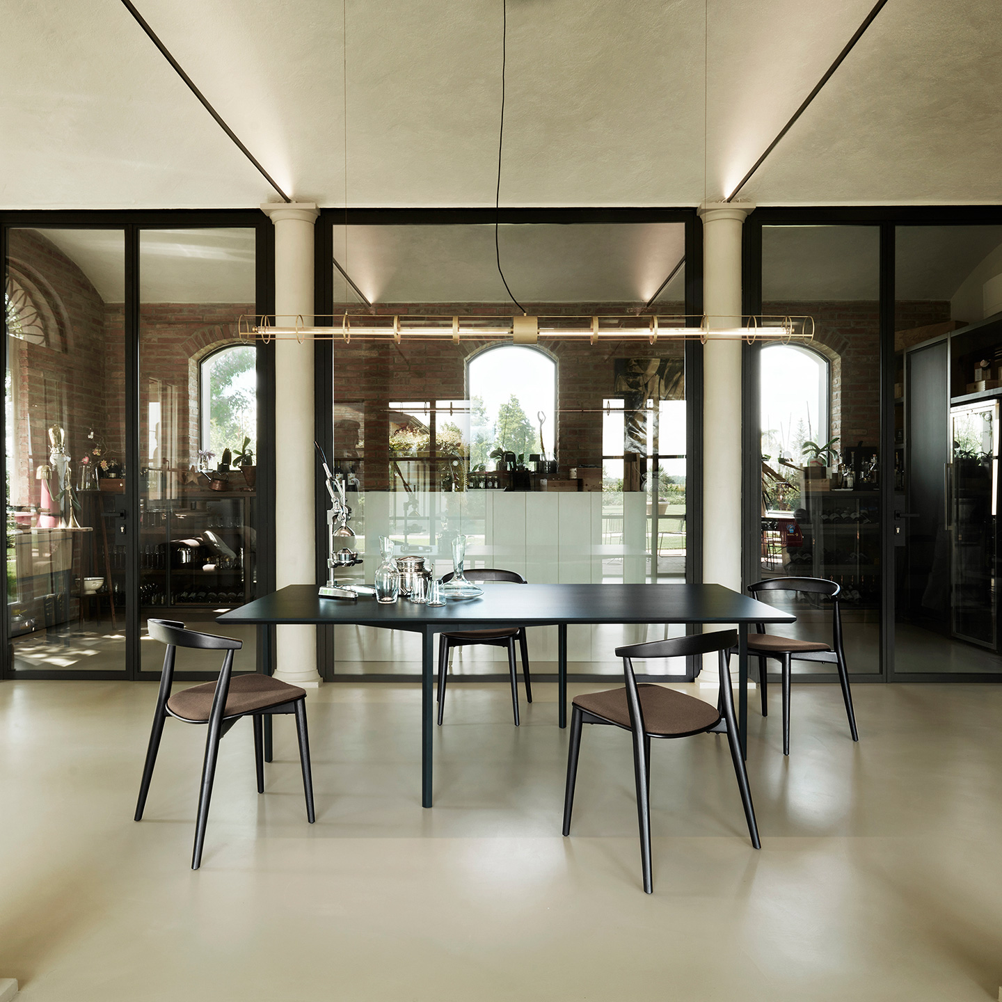 OpenUp meeting table is made of a base of laser-cut painted metal and a top in ash plywood.